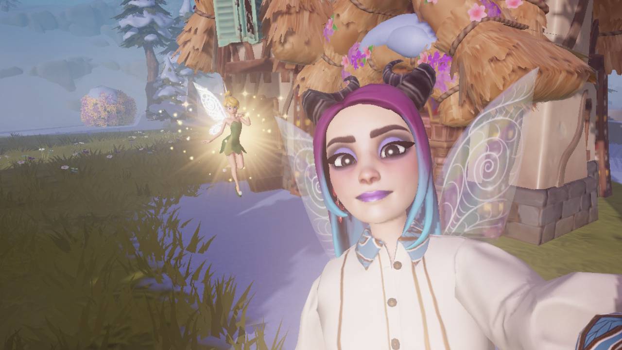 Disney Dreamlight Valley avatar and Tinker Bell in Wishblossom Ranch. A cottage and snowy trees and rocky cliffs can be seen in the distance. Tinker Bell is a main character in the 'Uneasy Neighbors' quest.
