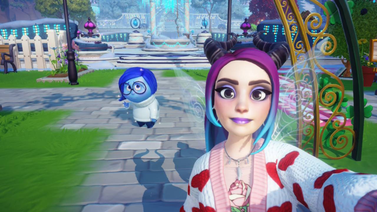 Disney Dreamlight Valley avatar stands next to Sadness for 'The Big Worry' quest. The Plaza well can be seen in the distance.